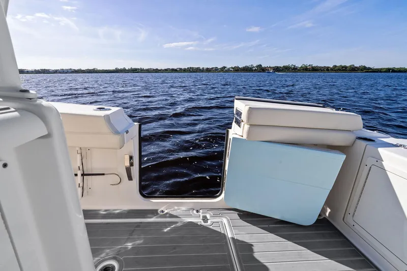 No Name Yacht Photos Pics 2023 Cobia 350 Center Console boat with open side door on calm water.