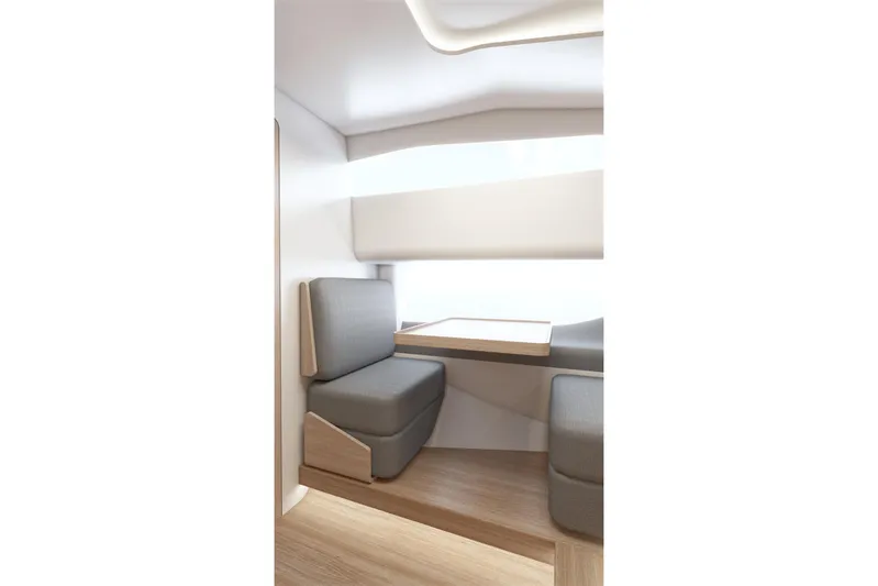  Yacht Photos Pics Modern interior of 2026 Piantoni 440 Open yacht with sleek seating and table.