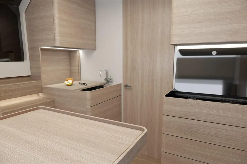  Yacht Photos Pics Modern kitchen interior of 2026 Piantoni 440 Open yacht, featuring sleek wood finishes.