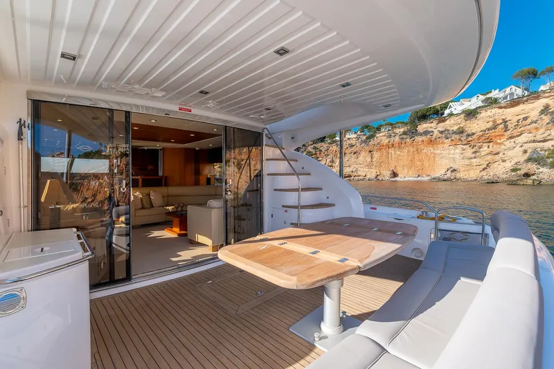  Yacht Photos Pics Luxurious 2008 Sunseeker Manhattan 70 yacht with elegant outdoor seating and scenic views.