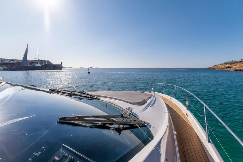  Yacht Photos Pics Sunseeker Manhattan 70 yacht cruising on clear blue waters, 2008 model.