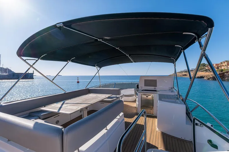  Yacht Photos Pics Sunseeker Manhattan 70 yacht deck, 2008 model, with ocean view and seating area.