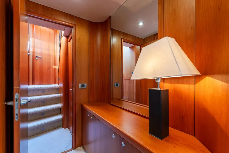  Yacht Photos Pics Luxurious wooden interior of 2008 Sunseeker Manhattan 70 yacht with elegant lamp and mirror.