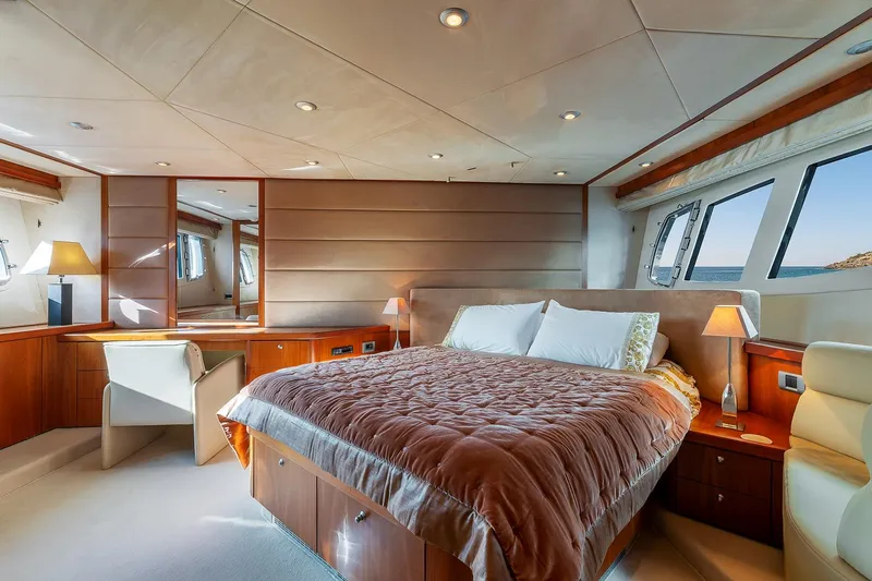  Yacht Photos Pics Luxurious bedroom interior of 2008 Sunseeker Manhattan 70 yacht with elegant furnishings.