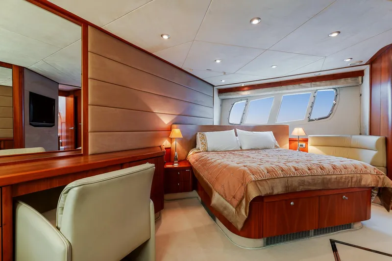  Yacht Photos Pics Luxurious bedroom interior of 2008 Sunseeker Manhattan 70 yacht with elegant furnishings.