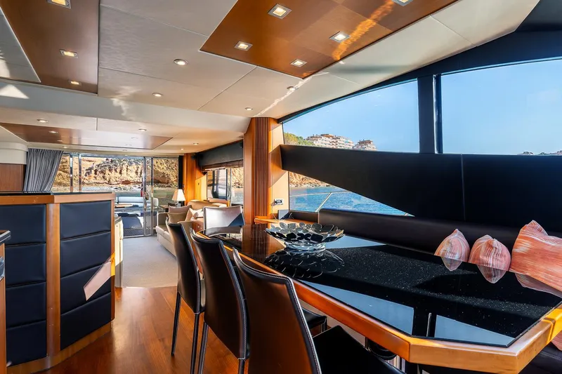  Yacht Photos Pics Luxurious interior of 2008 Sunseeker Manhattan 70 yacht with elegant dining area and scenic ocean view.