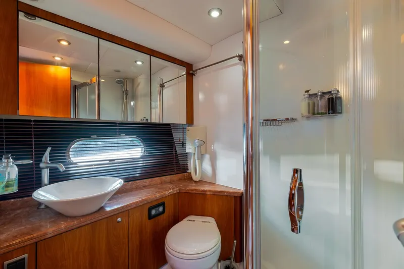  Yacht Photos Pics Luxurious bathroom in 2008 Sunseeker Manhattan 70 yacht with modern fixtures and elegant design.