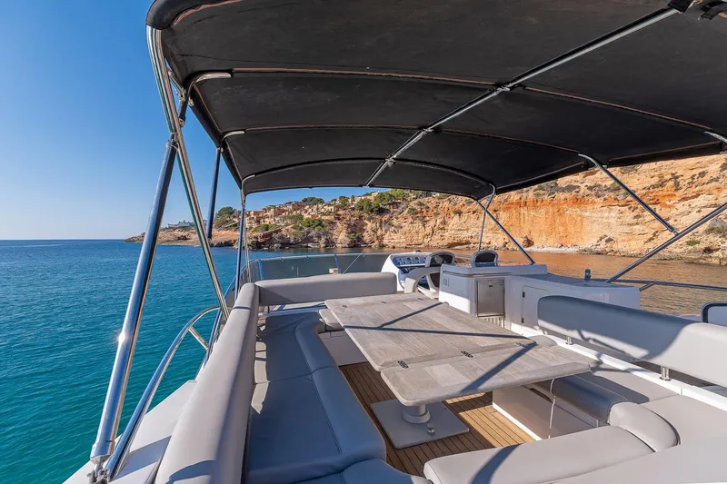  Yacht Photos Pics Sunseeker Manhattan 70 yacht deck, 2008 model, with seating and ocean view.