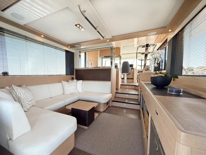 In Stock Yacht Photos Pics Luxurious interior of 2026 Beneteau Swift Trawler 54 with modern seating and elegant decor.