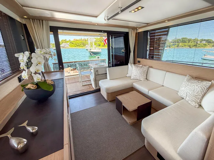 In Stock Yacht Photos Pics Luxurious interior of 2026 Beneteau Swift Trawler 54 with elegant seating and scenic ocean view.