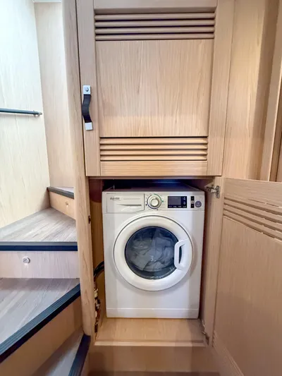In Stock Yacht Photos Pics Laundry area with washing machine in 2026 Beneteau Swift Trawler 54 yacht.