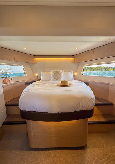 In Stock Yacht Photos Pics Luxurious bedroom in 2026 Beneteau Swift Trawler 54 with scenic ocean views.