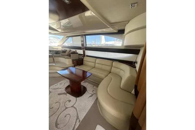 Havadk Yacht Photos Pics Luxurious interior of 2010 Meridian 391 Sedan yacht with elegant seating and wooden table.