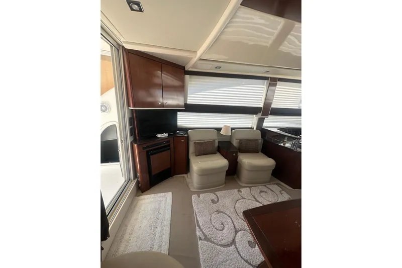 Havadk Yacht Photos Pics Interior of 2010 Meridian 391 Sedan yacht with plush seating and elegant wood cabinetry.