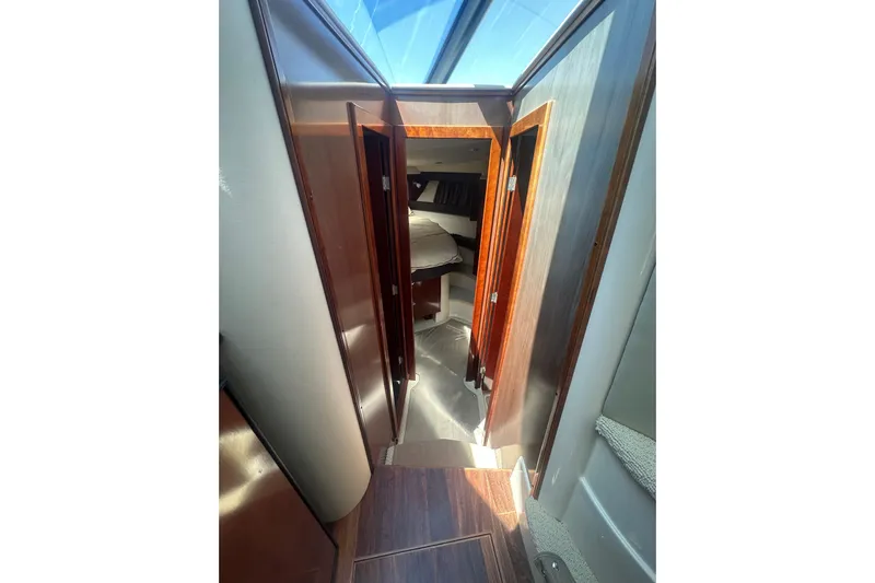 Havadk Yacht Photos Pics Interior hallway of 2010 Meridian 391 Sedan yacht with wood paneling and skylight.