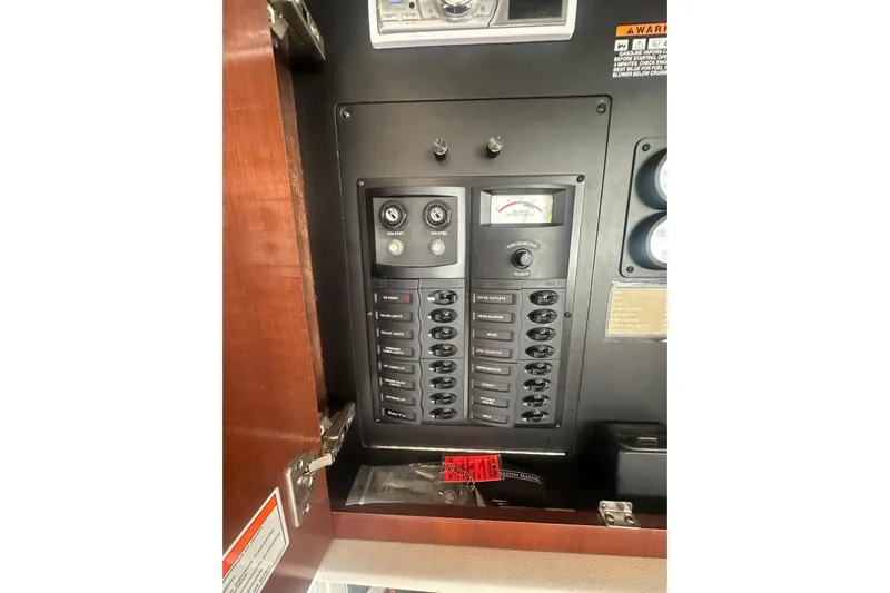 Havadk Yacht Photos Pics Electrical panel inside a 2010 Meridian 391 Sedan boat, featuring various switches and gauges.