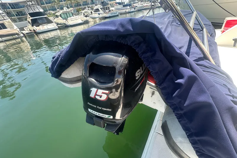 Havadk Yacht Photos Pics Outboard motor on a 2010 Meridian 391 Sedan, docked in a marina.