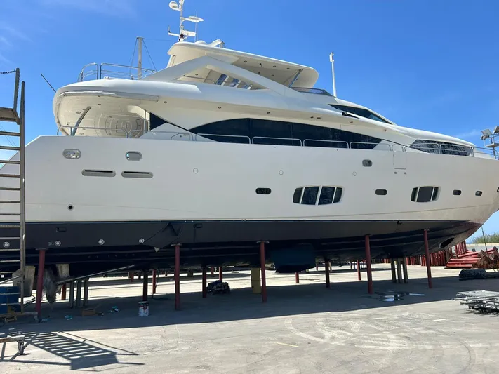 Paladium Yacht Photos Pics Sunseeker 30 Metre Yacht 2010 on dry dock under clear blue sky.