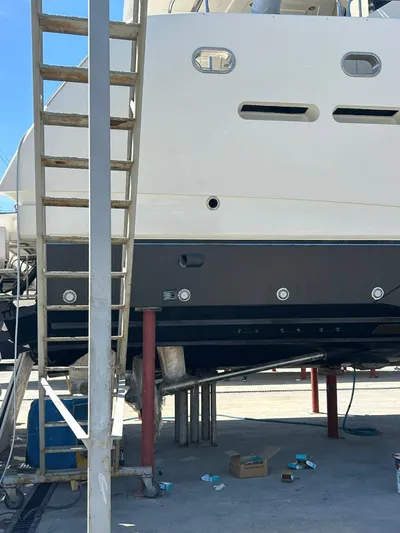 Paladium Yacht Photos Pics Sunseeker 30 Metre Yacht 2010 under maintenance with ladder and tools nearby.