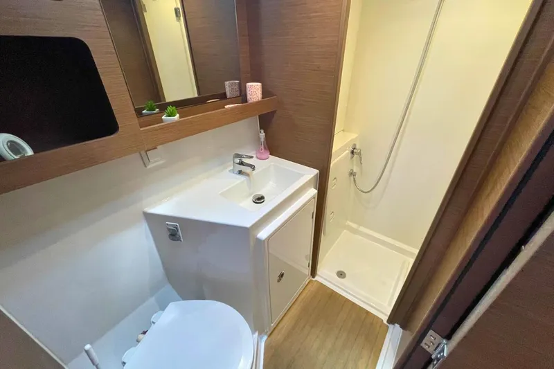 Lucky Vibes Yacht Photos Pics Bathroom interior of 2018 Lagoon 42 yacht with shower and sink.