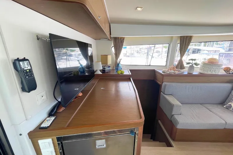 Lucky Vibes Yacht Photos Pics Interior of 2018 Lagoon 42 yacht with TV, seating, and decor.