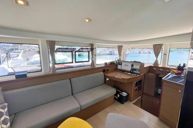 Lucky Vibes Yacht Photos Pics Interior of 2018 Lagoon 42 catamaran with modern navigation equipment and comfortable seating.