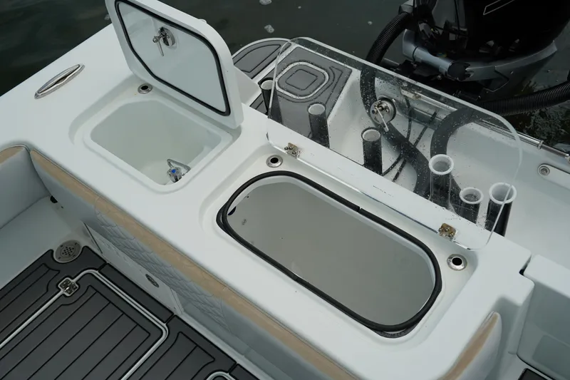  Yacht Photos Pics Andros 32 Offshore 2023 boat deck with storage compartments and rod holders.