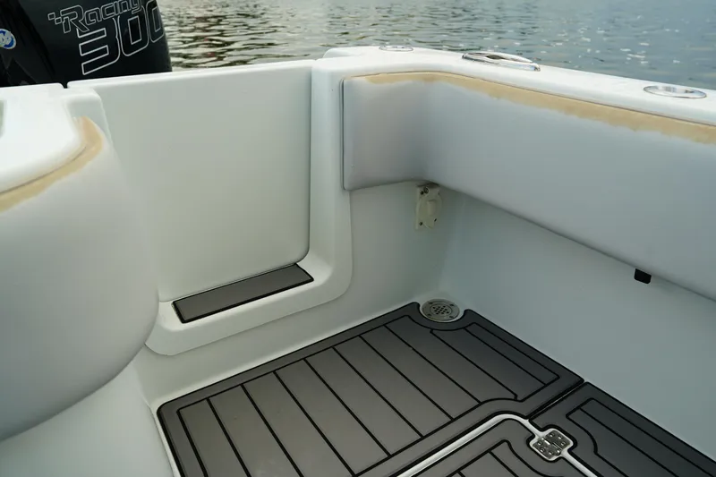  Yacht Photos Pics 2023 Andros 32 Offshore boat interior with sleek flooring and cushioned seating.