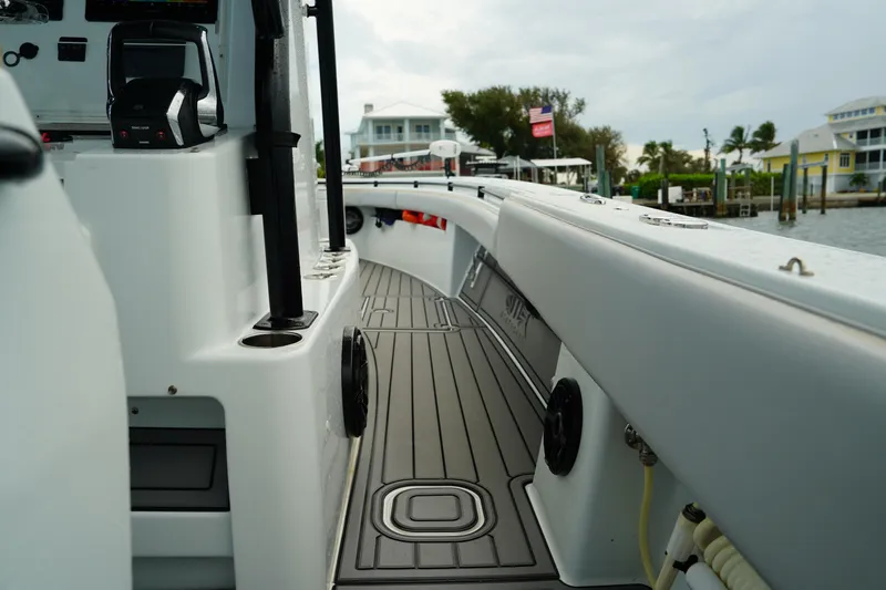  Yacht Photos Pics 2023 Andros 32 Offshore boat deck with modern design and coastal background.