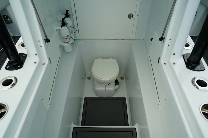  Yacht Photos Pics 2023 Andros 32 Offshore boat interior with toilet and storage compartments.