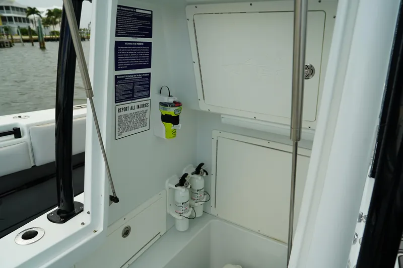  Yacht Photos Pics 2023 Andros 32 Offshore boat interior with storage compartments and safety equipment.