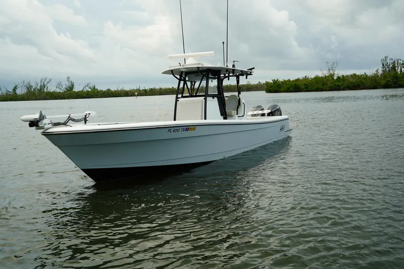  Yacht Photos Pics 2023 Andros 32 Offshore boat on calm water under cloudy sky.
