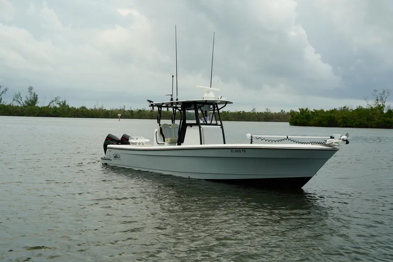  Yacht Photos Pics 2023 Andros 32 Offshore boat on calm water under cloudy sky.