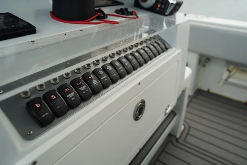  Yacht Photos Pics Control panel of 2023 Andros 32 Offshore boat with multiple switches.