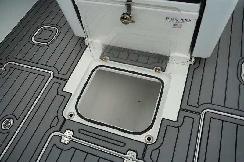  Yacht Photos Pics 2023 Andros 32 Offshore boat deck with storage compartment and Frigid Rigid cooler.