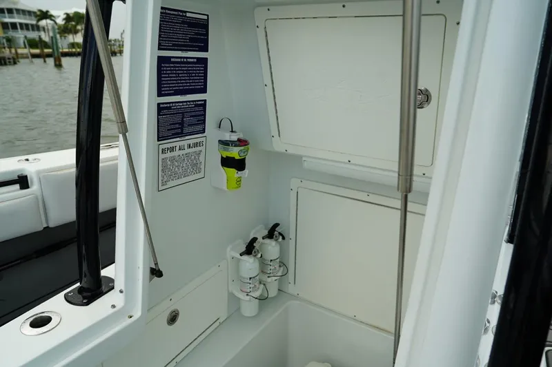  Yacht Photos Pics 2023 Andros 32 Offshore boat interior with storage compartments and safety equipment.