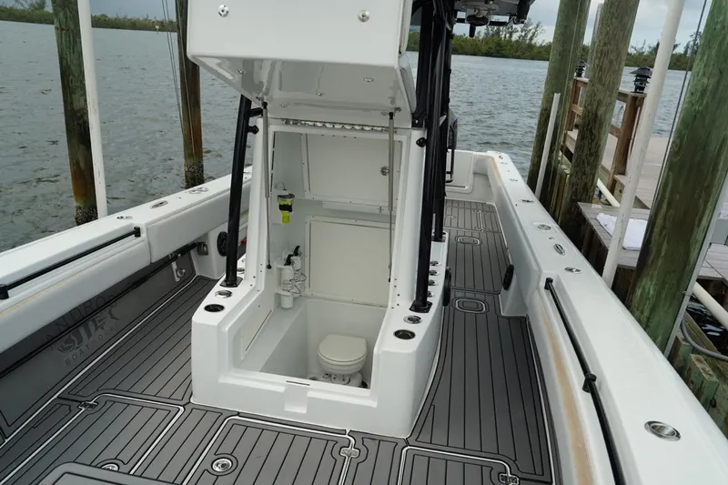  Yacht Photos Pics 2023 Andros 32 Offshore boat interior with open console and marine toilet.