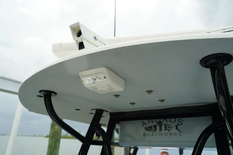  Yacht Photos Pics 2023 Andros 32 Offshore boat roof with mounted equipment and Andros Boatworks logo.