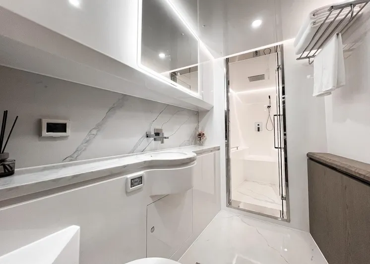 Diamond Yachts Ef56 Yacht Photos Pics Luxurious bathroom in 2024 Catamaran Diamond Yachts EF56 with modern fixtures and marble accents.