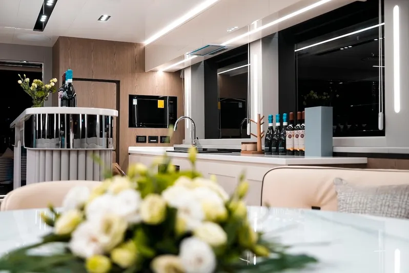 Diamond Yachts Ef56 Yacht Photos Pics Luxurious interior of 2024 Catamaran Diamond Yachts EF56 with modern kitchen and elegant decor.