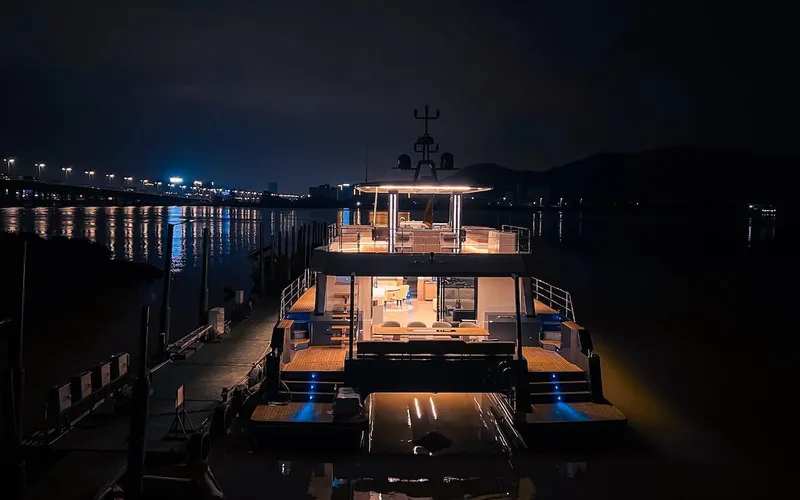 Diamond Yachts Ef56 Yacht Photos Pics 2024 Catamaran Diamond Yachts EF56 illuminated at night, docked in a serene marina.