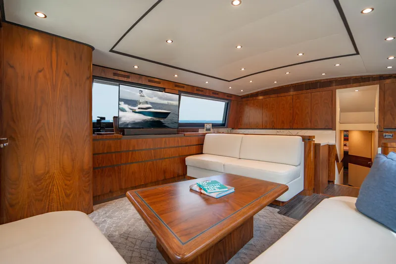 Bel Esprit Yacht Photos Pics Luxurious interior of 1999 Jim Smith Custom 66 Sportfish yacht with elegant wood finishes.