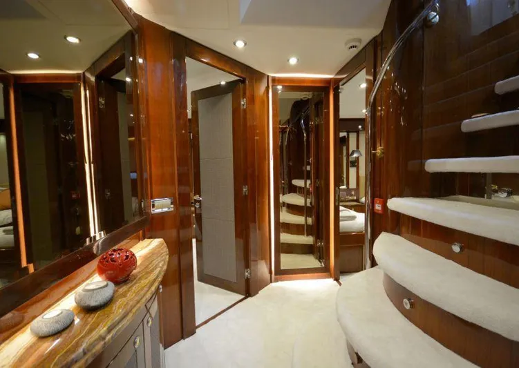 Paladium Yacht Photos Pics Luxurious interior of 2010 Sunseeker 30 Metre Yacht with elegant wood finishes and spiral staircase.