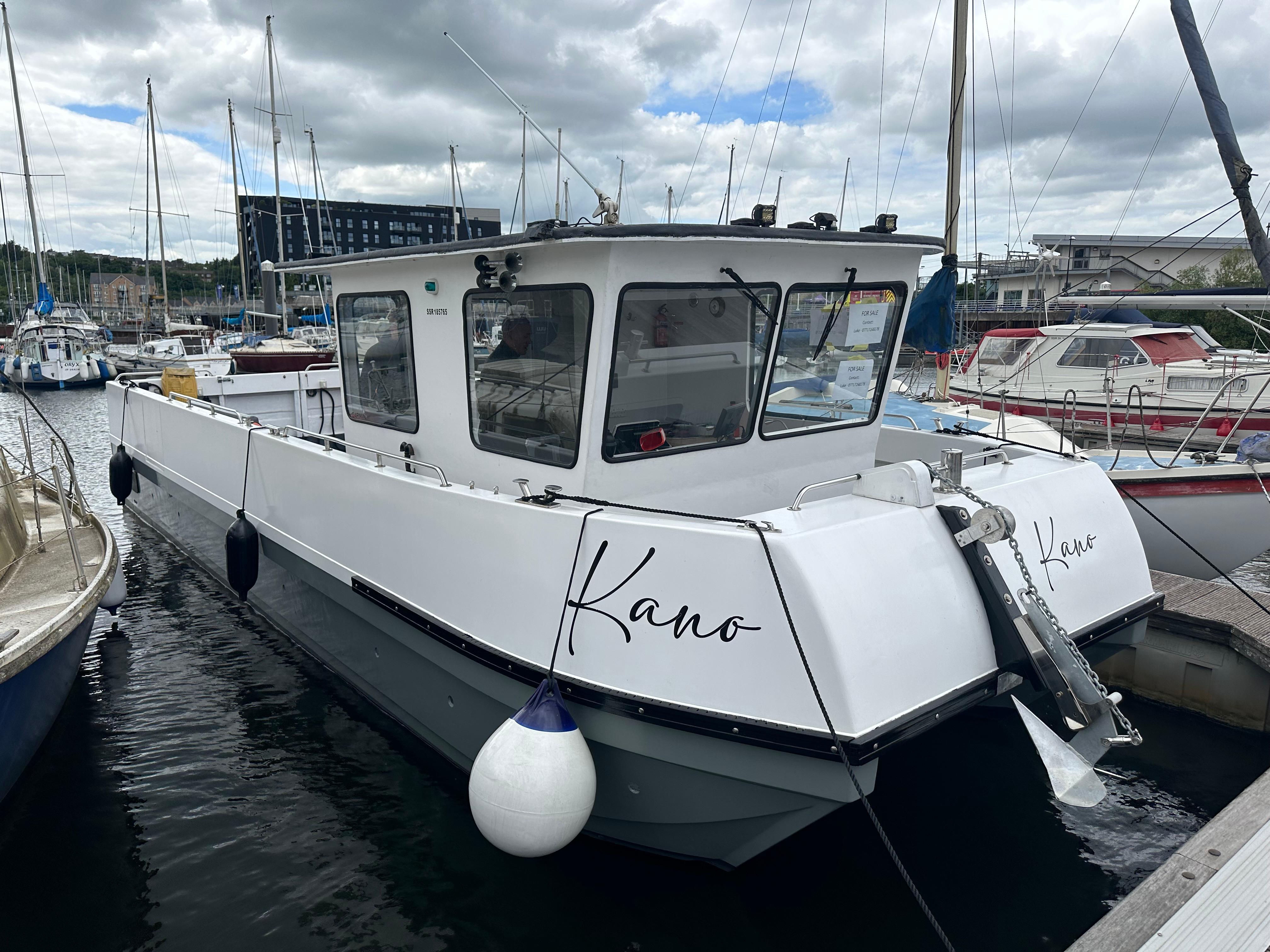 large catamaran with outboards