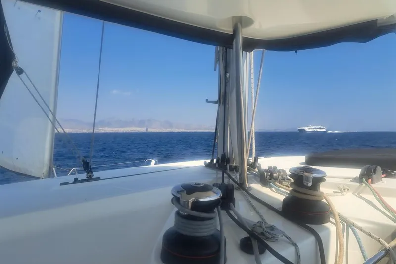  Yacht Photos Pics Sailing on a 2020 Lagoon 42 catamaran with ocean and distant ferry view.