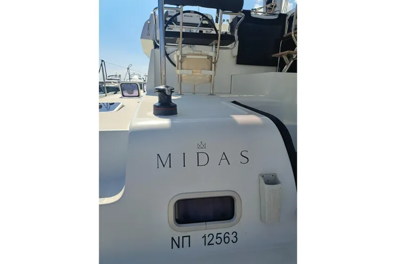  Yacht Photos Pics Lagoon 42 catamaran, 2020 model, named "Midas" with visible deck and seating area.