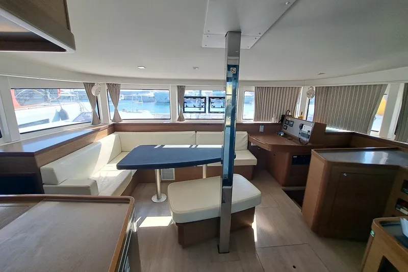  Yacht Photos Pics Interior of 2020 Lagoon 42 catamaran with spacious seating and navigation area.