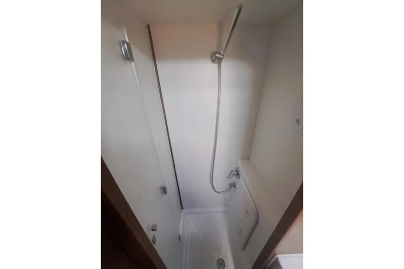  Yacht Photos Pics Compact shower area in a 2020 Lagoon 42 yacht, featuring a sleek design.