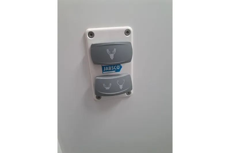  Yacht Photos Pics Jabsco control panel on 2020 Lagoon 42 yacht, featuring two grey buttons.