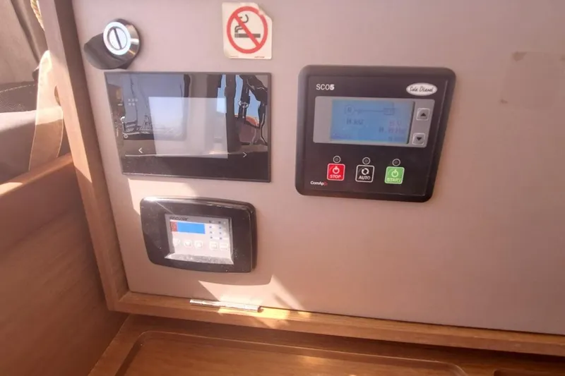  Yacht Photos Pics Control panel inside a 2020 Lagoon 42 catamaran, featuring various electronic displays.